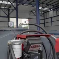 Vue détaillée de la pompe et des accessoires sur une cuve à mazout en acier double paroi, avec filtre et pistolet automatique.